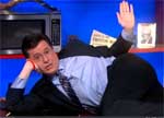 Colbert on a stack of bibles