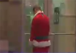 santa clause peeing on a building