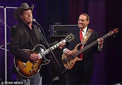 Mike Huckabee sings Cat scratch fever with ted Nugent