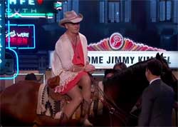 Bill Murray arrives horseback in a dress 