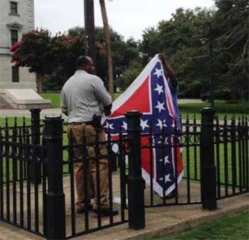 Blacks raise confederate flag