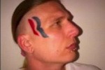 Eric Hartsburg auctioned his face off on ebay, and now wears a Romney - Ryan Tattoo                             